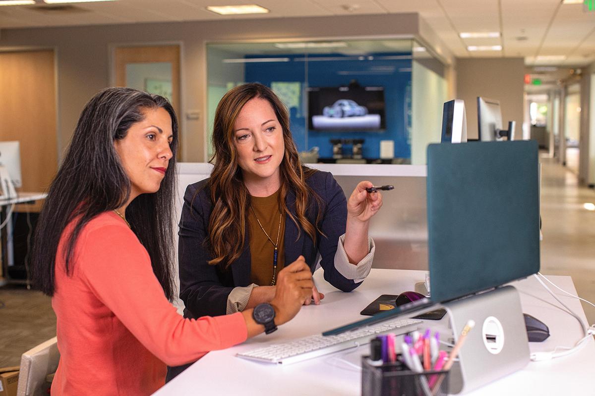 Two businesswomen in discussion at an office